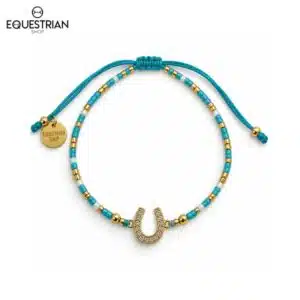 Bracelet Summer EQUESTRIAN SHOP bleu turquoise vu de face avec fer à cheval serti de strass et détails dorés