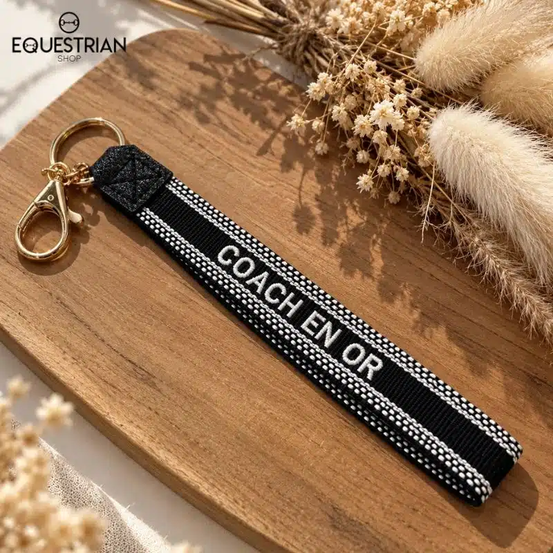 Porte-clés Coach en Or EQUESTRIAN SHOP noir avec inscription brodée et anneaux dorés